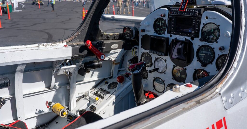 Inside view of a vintage aircraft cockpit at an airshow, showcasing gauges and controls.